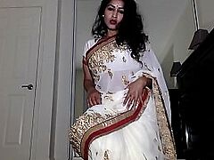 Experienced aunt strips Indian dress to reveal hairy vagina and pleases with object.