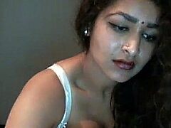 Desi beauty teases and pleases on webcam with sensual touch.