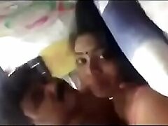Sexual Tamil woman satisfies her desires with a black toy, moaning in ecstasy.