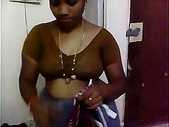 Srilatha Reddy, a mature aunty, gets down and dirty in a hot dehati encounter. Watch her wild, uninhibited sex session.