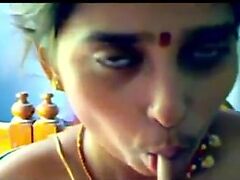 Inexperienced Indian housewife explores her desires, eagerly grabbing onto her lover's hard shaft, leaving him moaning in pleasure.