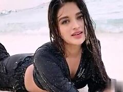 Seductive Nidhhi Agerwal's teasing moves heat up the room, igniting a passionate mood.